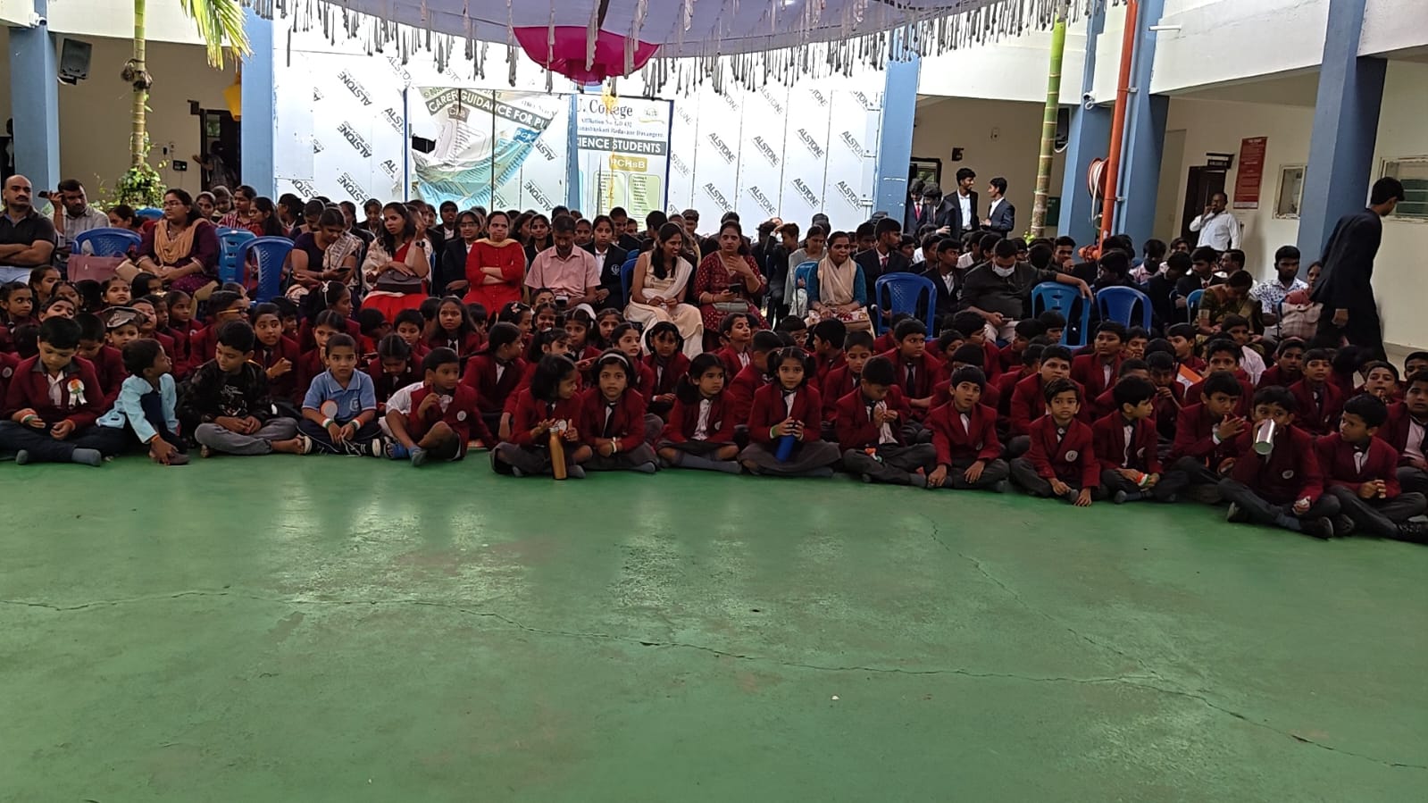 School assembly under the courtyard canopy
