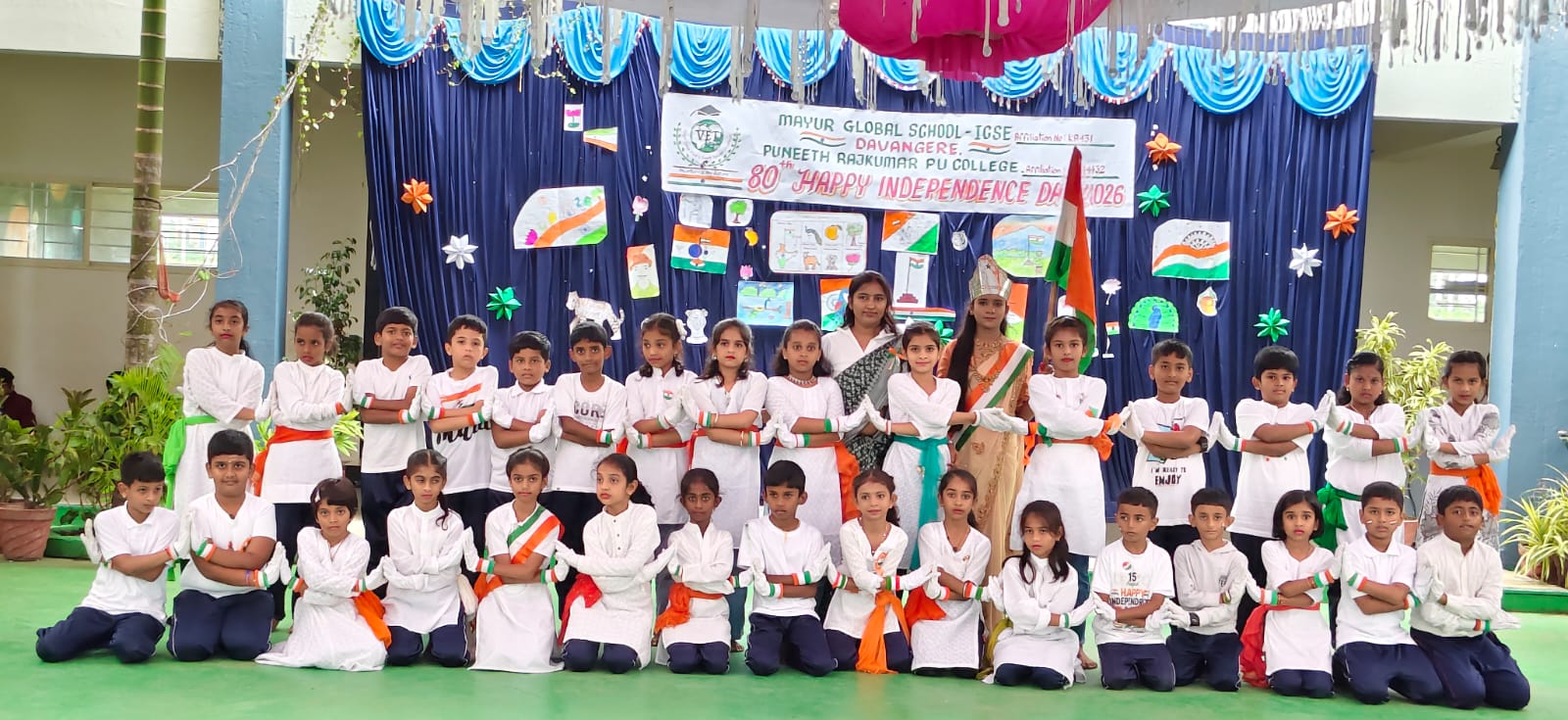 Students in patriotic costumes on the school stage
